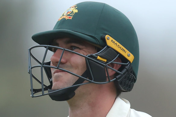 Wry smile: Pat Cummins is dismissed on the final day at Galle.