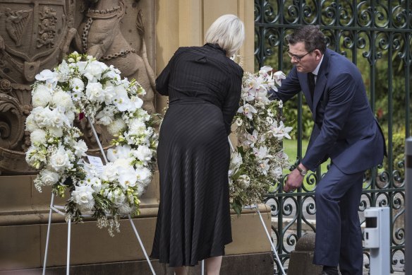 Premier Daniel Andrews and his wife Catherine laying a wreath at Government House on Friday.