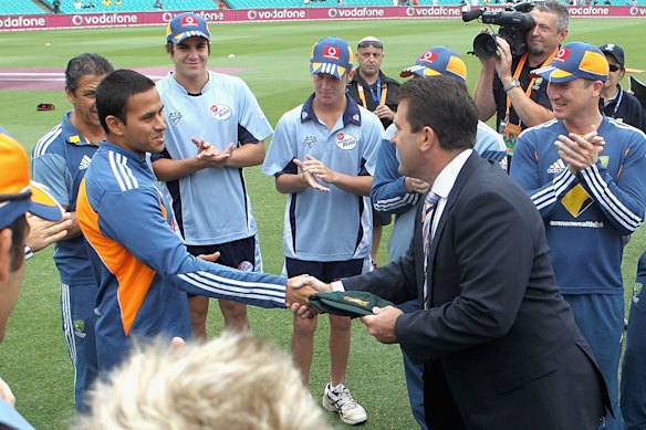 Mark Taylor present Usman Khawaja with his baggy green in 2011.