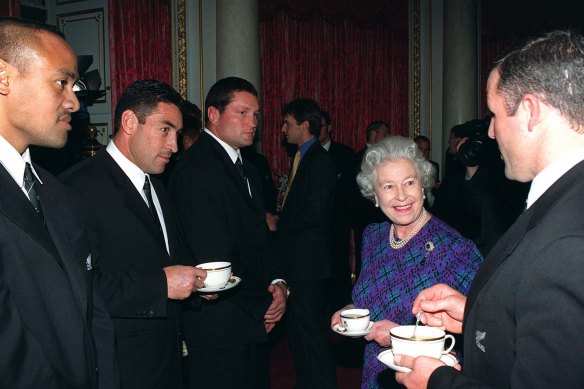 The Queen takes tea with the All Blacks in 1997.