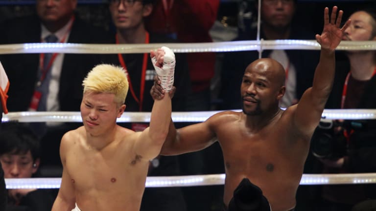 Great champion: Mayweather, left, paid tribute to Tenshin Nasukawa after their lucrative New Year's Eve showdown.