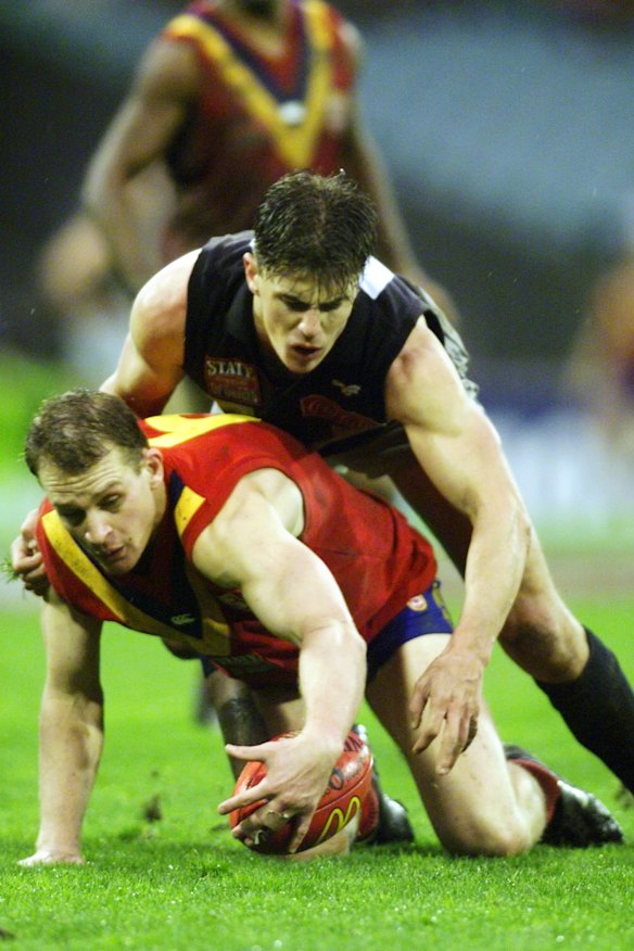 Matthew Lloyd tackles Sean Wellman in the 1999 encounter.