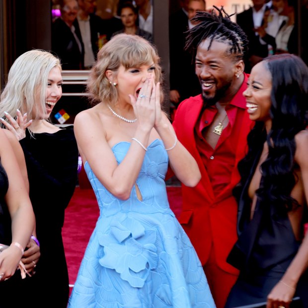 Taylor Swift with dancers and crew attend Taylor Swift: The Eras Tour premiere in Los Angeles on October 11.