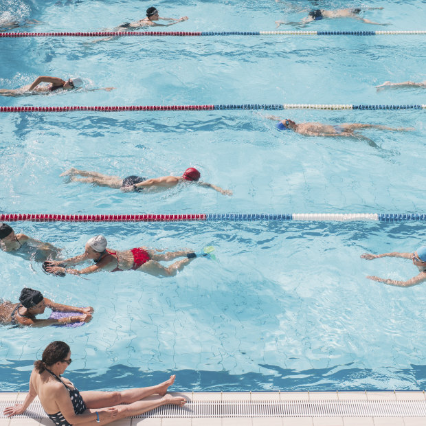 People swim in the Butte-aux-Cailles municipal pool in Paris.