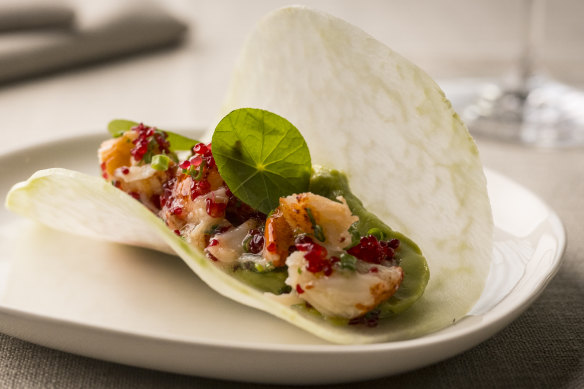 Lobster is swaddled in a thin sheet of jicamo, taco style.