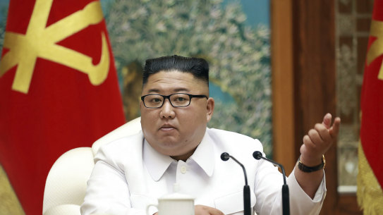 Kim Jong-un attends an emergency Politburo meeting in Pyongyang on July 25.
