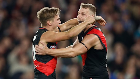 Matt Guelfi and Jake Stringer celebrate during the Bombers’ close win.