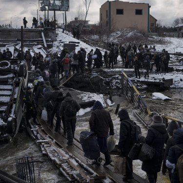 People flee Kyiv on March 8.