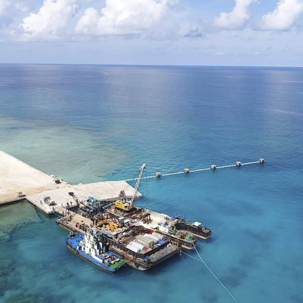 Ships carrying building materials docked at a new beach ramp at the Philippine-claimed island of Pag-asa, also known as Thitu, in the South China Sea in June, 2020.