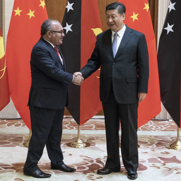 PNG leader Peter O'Neill meets Xi Jinping in Beijing on June 21.