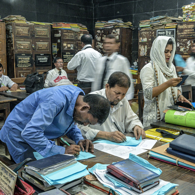 Lawyers crammed into a room at the Bar Association building in Dhaka, Bangladesh.