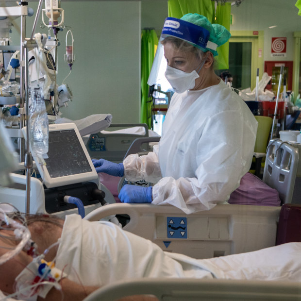 Dr Annalisa Malara next to a patient in the COVID-19 intensive care unit of the Ospedale Maggiore di Lodi.