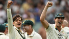 Sam Konstas and Pat Cummins of Australia celebrate victory.