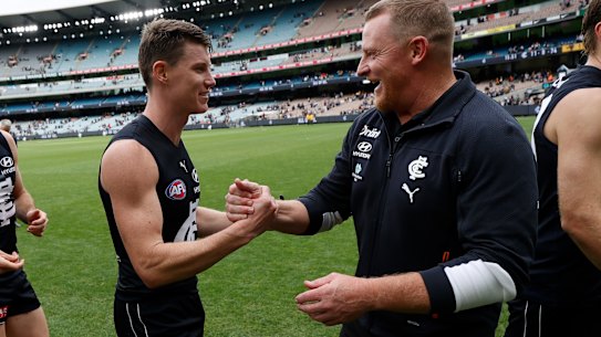 Sam Walsh with coach Michael Voss after the Blues win over Hawthorn.