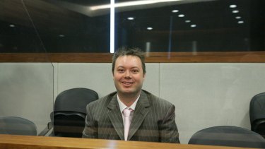 Carl Williams sits behind bullet-proof glass at Melbourne Magistrates Court in 2007.