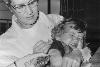 A child gets a polio injection at Broadmeadows Town Hall in January 1968.