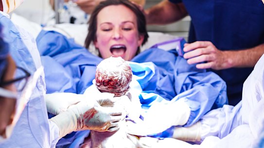 Mother Bec Secomb delivering her baby girl Lulu at Northern Beaches Hospital.