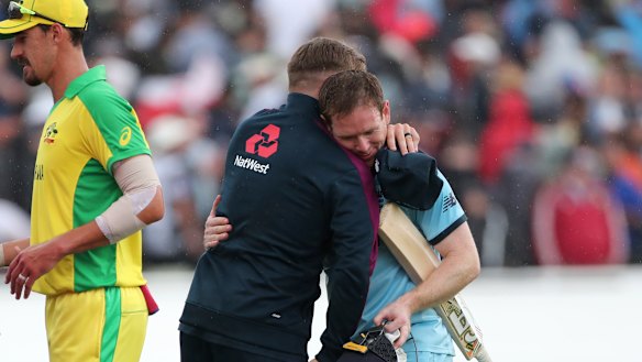 England captain Eoin Morgan, right, hugs teammate Jason Roy after England's semi-final win over Australia. 