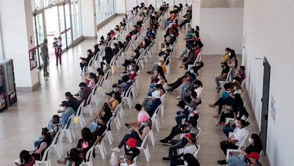 Residents wait in line to receive COVID-19 vaccine.