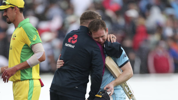 England captain Eoin Morgan, right, hugs teammate Jason Roy after England's semi-final win over Australia. 