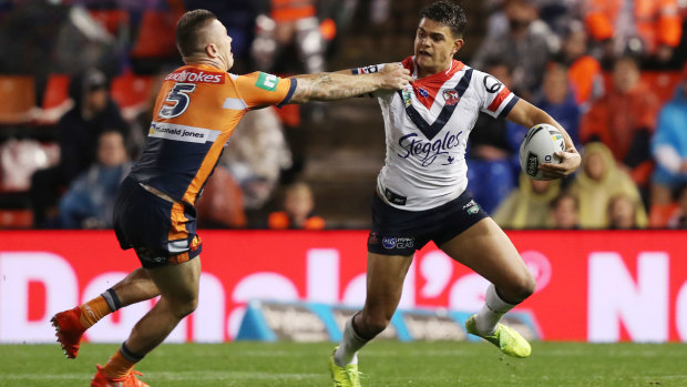 Pushing himself... and others: Latrell Mitchell's right-hand fend has been a sight to behold in 2018.