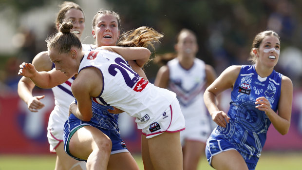 Stephanie Cain bumps Grace Campbell during the Dockers’ win. 