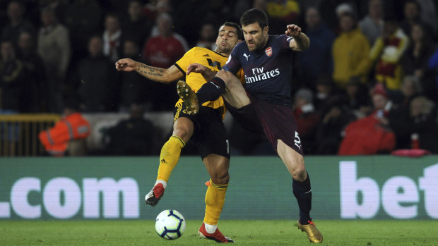 Arsenal's Sokratis Papastathopoulos (right) duels for the ball with Wolverhampton's Jonny Otto. 