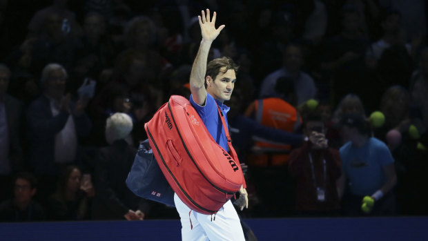 Vanquished: Roger Federer waves to fans following his semi-final defeat.