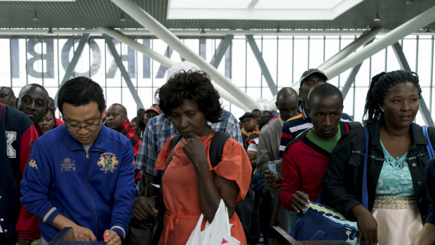 Chinese employees help passengers at the new Standard Gauge Railway terminal in Nairobi, Kenya.