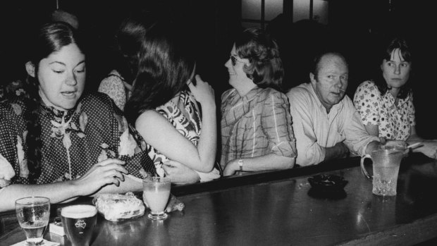 Members of the Women's Electoral Lobby invade a public bar in 1974.