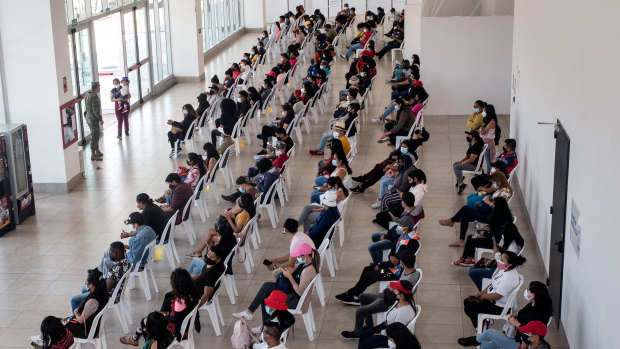 Residents wait in line to receive COVID-19 vaccine.