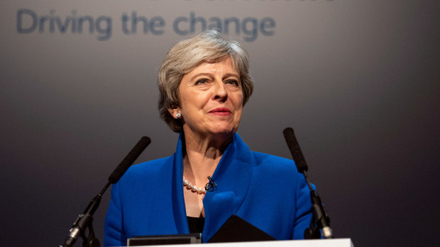 Theresa May delivers a speech at the Zero Emission Vehicle Summit in Birmingham on Tuesday.