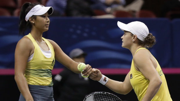 Ashleigh Barty (right) and Priscilla Hon celebrate a point during the Fed Cup.