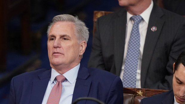 Representative Kevin McCarthy listens as votes are cast.