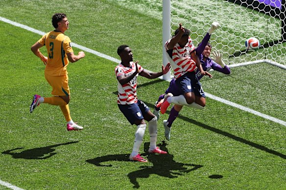 Alex Freeman heads the ball into goal. 