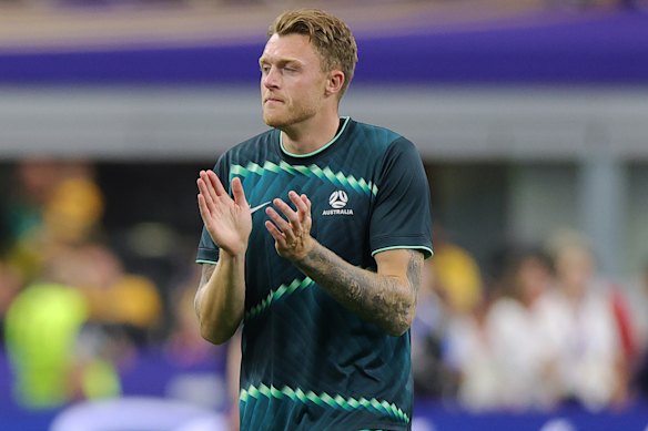 Harry Souttar warms up before the match.