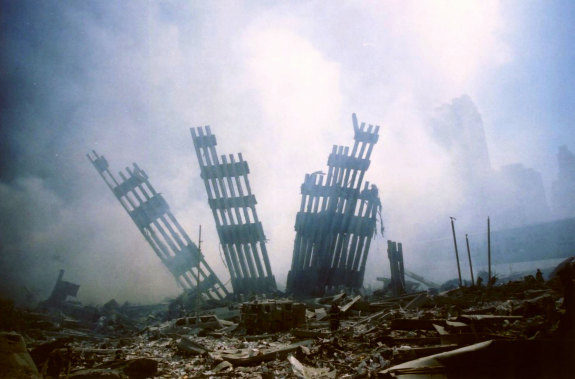 Ten days after the 9/11 terrorist attacks the remains of the World Trade Centre stand surrounded by debris. 