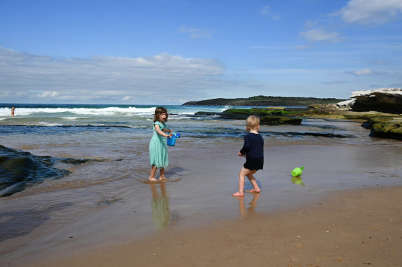 Alice and her brother Neo, 2, playing in North Maroubra’s new rocky cove.