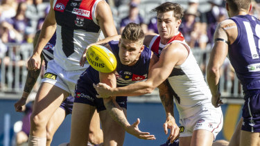 Tangled up: Saint Rowan Marshall takes on  Docker Rory Lobb.