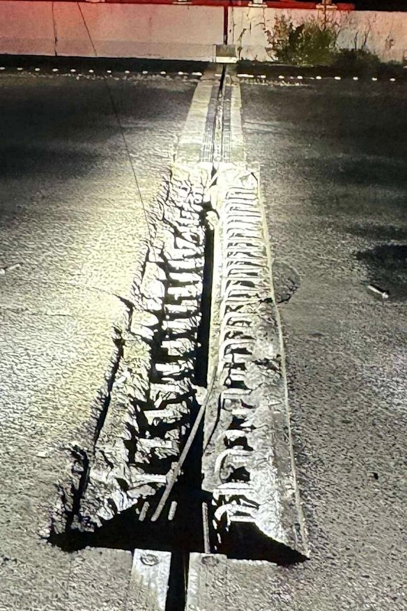Damage to the road in the closed section of the freeway.