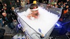 Wim Hof breaking a record for immersion in an ice bath. But are far shorter dips even healthy?