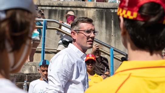 NSW Premier Dominic Perrottet speaks to volunteer surf lifesavers and Coogee nippers on Wednesday.