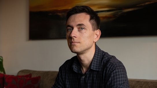 Thomas Buxereau stand for a portrait in his apartment in Sydney on June 13, 2022. Story about a campaign to lift the ban on gay men donating blood unless they are abstinent. Photo: Flavio Brancaleone/The Sydney Morning Herald