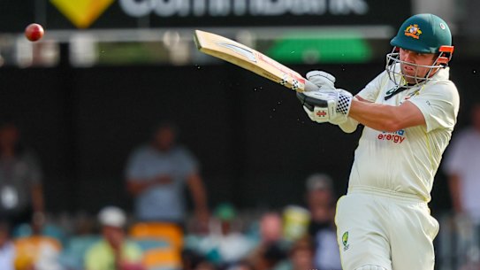 Travis Head takes to the South African bowling attack in Brisbane.