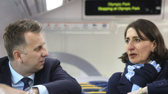 Transport Minister Andrew Constance and Premier Gladys Berejiklian aboard a new Waratah train in Sydney in 2018.