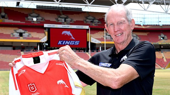 Wayne Bennett with the new jersey to be worn by The Dolphins.