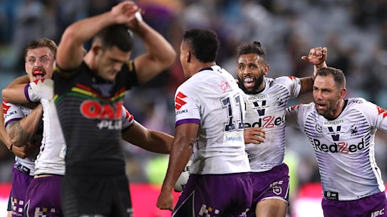 Cameron Smith and Josh Addo-Carr celebrate.