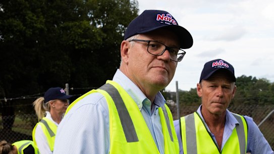 Prime Minister, Scott Morrison, walks through the Norco factory in South Lismore which was devastated by the floods.