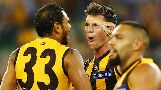 Stand-in Hawks skipper Jaeger O’Meara with former teammate Cyril Rioli in 2018, before Rioli’s retirement.