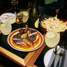 Oysters, fries and free-range chicken with burnt chilli nuoc mam at Firebird.